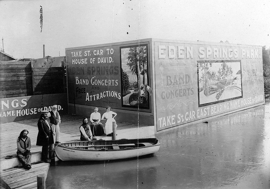 This early advertisement on St. Joseph's waterfront encouraged passengers of the many steamships that came across the lake from Chicago to take the street car lines to the park. St. Joseph and Benton Harbor had a long history of being a popular weekend destination for Chicagoans, and Eden Springs Park added to the attraction. Brother Benjamin is visible along with several colony members. The small boat, the Morning Star, was built at the House of David.