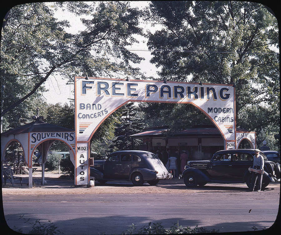 Early visitors frequently arrived to the park via trolleys. But increasing numbers arrived in their own cars and made use of the free parking lot on Britain Avenue, in front of the Diamond House. The parking lot entrance, seen here in the early 1940s, features a series of arches. This was a form of architectural symbolism of the Israelite faith, representing the joining of the 5th and 6th churches to form the 7th.