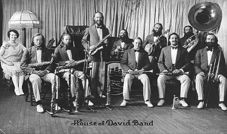 By the early 1920's popular music in the United States was undergoing a Jazz revolution.  It appears that the twenty-piece House of David road band was playing Jazz no later than 1919.  Late in 1920 the band reorganized as two ten piece bands to focus exclusively on playing Jazz.  Gone were the big brass band and the marches.  This new arrangement usually consisted of two coronets, two saxophones, two trombones, a tuba, a banjo, a piano and drums.  It was optimized for playing early Jazz, now known as ''Classic'' or ''Hot'' Jazz.
