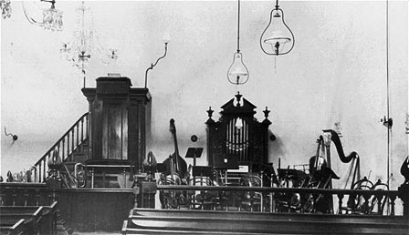 By the time of the American Civil War John Wroe had traveled numerous times to Australia and America establishing Christian Israelite Societies in these countries.  This picture was taken in Melbourne, Australia around 1895.  It shows that by the end of the nineteenth century an instrumental music tradition was firmly established in the Christian Israelite Church.  Over twenty instruments are shown in this Christian Israelite sanctuary including a pipe organ, several brass horns, woodwinds and numerous stringed instruments including a concert sized harp. 